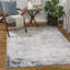 Tapis abstrait bleu / gris clair / blanc Magallanes-144949198