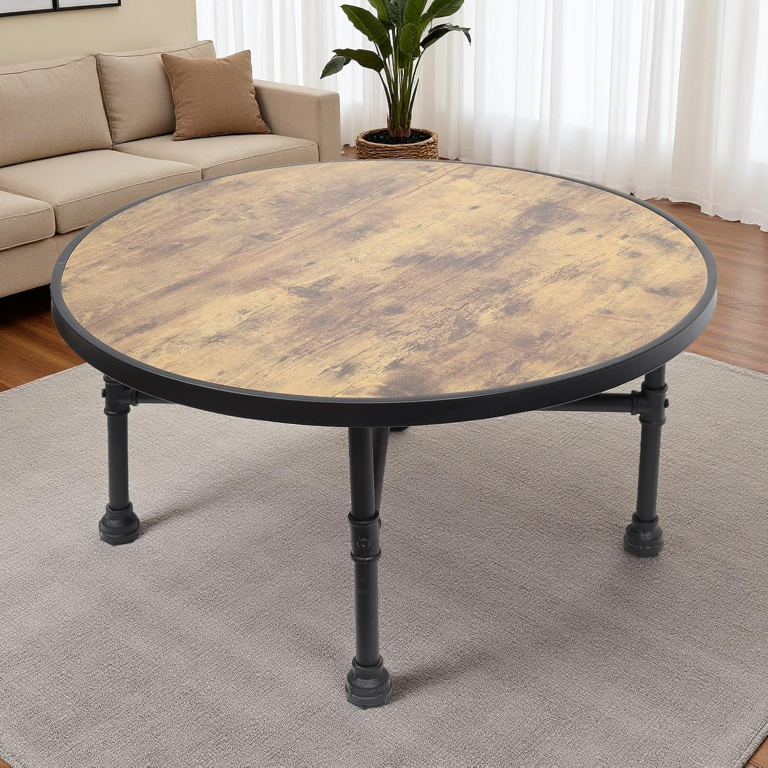 Photo inspiration: Metal Pipe Coffee Tables Reference: 17 Stories Industrial Round Coffee Table Circle Wood Pottery Barn
