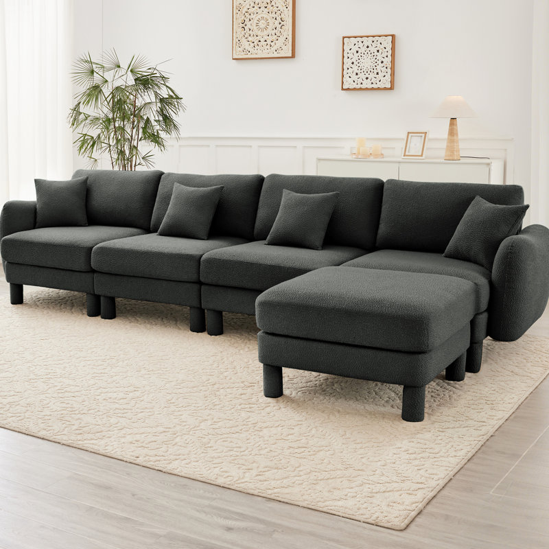 Canapé modulaire à 4 places en tissu bouclé gris foncé avec système de confort rembourré en mousse dense, courbé, amovible et à ressorts pour un confort optimal
