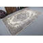 Crafted by artisans, this vintage Turkish rug showcases detailed floral designs in neutral hues.
