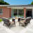 Bertolde 4 - Person Steel Patio Dining Set Rectangular Table with Cushions Included