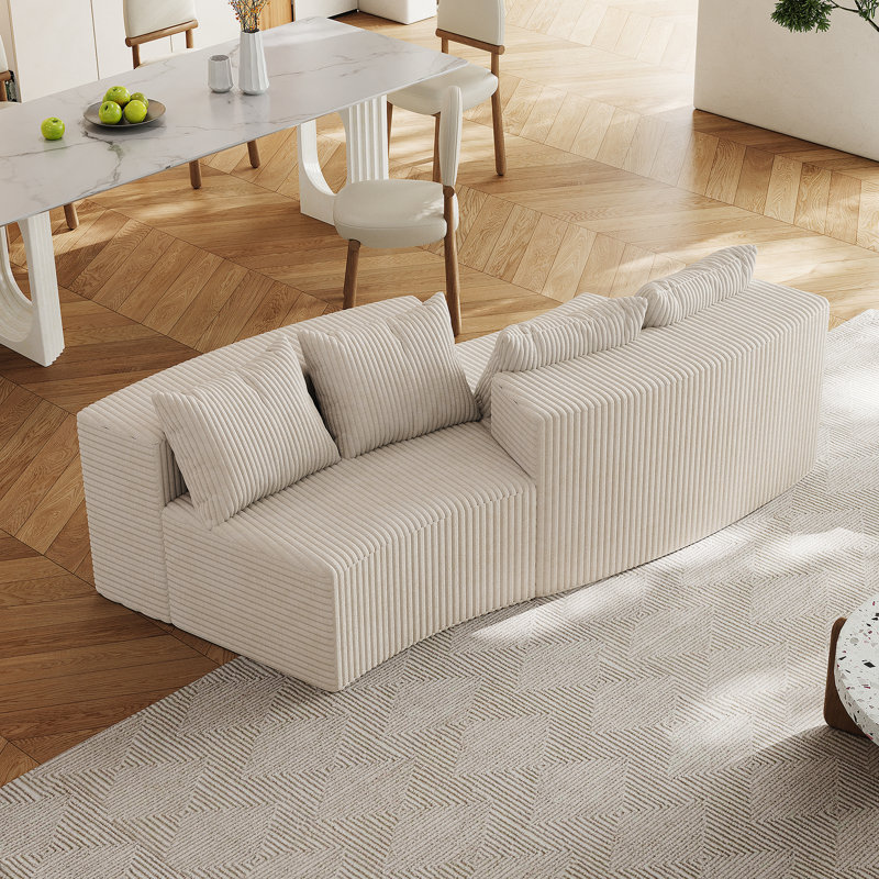 Canapé modulaire incurvé confortable avec quatre coussins, idéal pour diverses pièces, Chenille beige