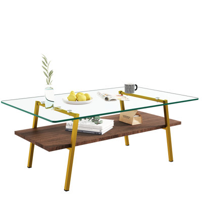 Table moderne pour le salon avec plateau en verre trempé transparent et pieds en métal