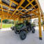 Abri d'auto extérieur en bois de cèdre avec toit en pente en acier galvanisé robuste et PowerPort Backport Discovery Kingsport 20 pi x 20 pi