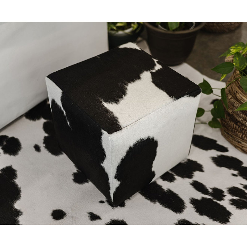 Repose-pieds en cuir de vache - pouf décoratif noir et blanc