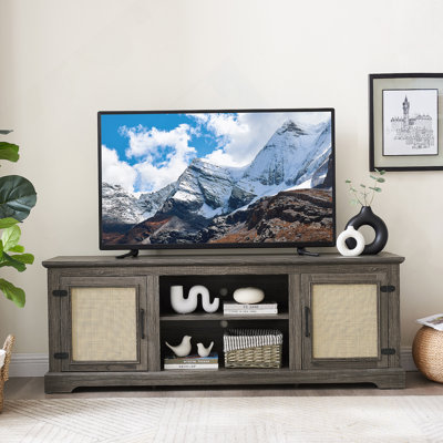Meuble télé multifonctionnel avec portes coulissantes et gestion des câbles, idéal pour le divertissement à domicile et la décoration