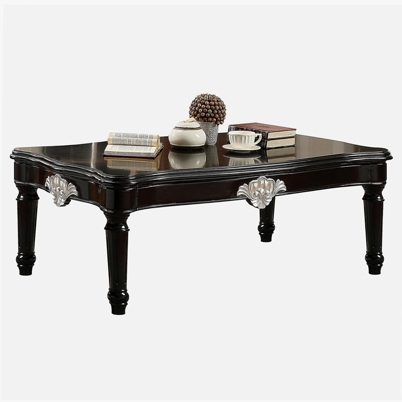 Table basse noire à pieds rotatifs