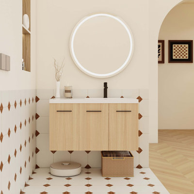 Meuble-lavabo mural flottant de 36 pouces avec lavabo en gel intégré et armoire de rangement modulaire à 3 portes pour des salles de bain modernes peu encombrantes.