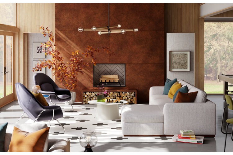 Living room arrangement with a white sectional sofa across from two blue modern chairs and in front of a fireplace.