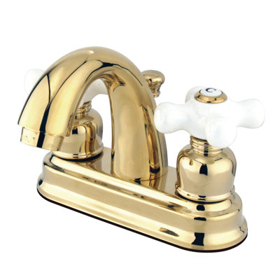 Kingston Brass Restoration Two-Handle 3-Hole Deck Mount 4" Centerset Bathroom Faucet with Plastic Pop-Up