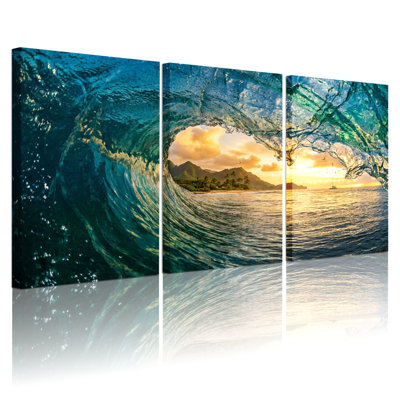 Ensemble de 3 tableaux sur toile représentant des vagues au coucher du soleil