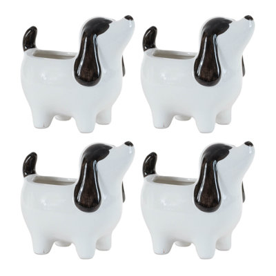 Ensemble de quatre jardinières pour chien en polyrésine noir et blanc