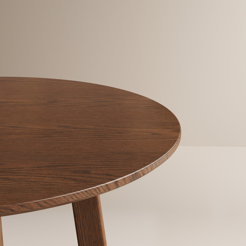 Table de salle à manger ronde en noyer de style Mid-Century avec piètement à tréteaux ouvert.