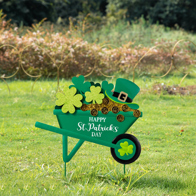 st patricks themed yard sign - wheelbarrows filled with shamrocks