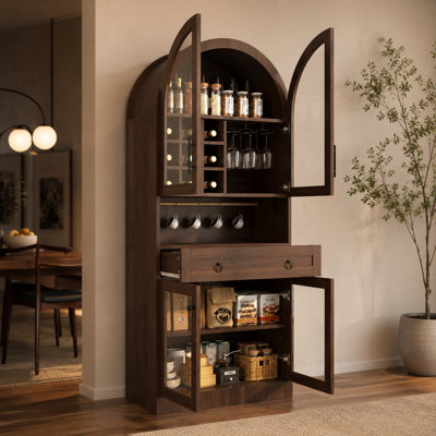 Medieval-style walnut-colored arched wine/coffee bar cabinet with adjustable shelves, hooks, wine racks, glass doors, and large drawers.