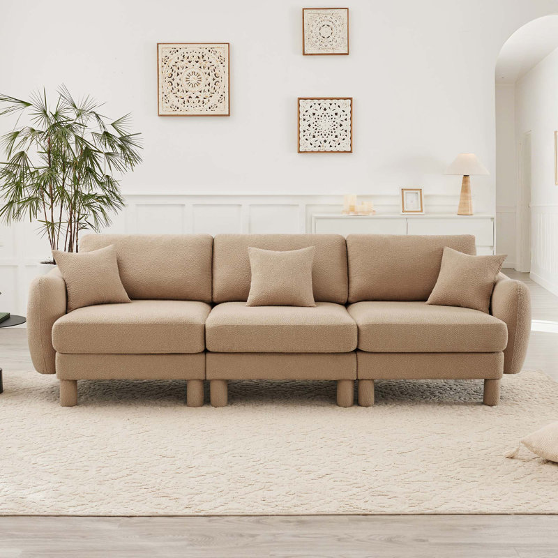 Canapé 3 places Boucle avec accoudoirs distinctifs en forme de coquillage, pieds cylindriques recouverts de tissu, Café