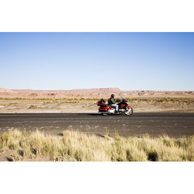 Biker On Highway by Pmphoto - Wrapped Canvas Print