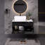 Petit meuble-lavabo flottant simple avec lavabo, conception peu encombrante pour les salles de bain modernes et compactes.