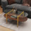 Table basse ovale en verre de forme moderne, format 41 po x l 21 po x H 17 po, pour le salon, structure à double couche avec fonction de rangement, verre transparent et panneau de fibres à densité moyenne brun café
