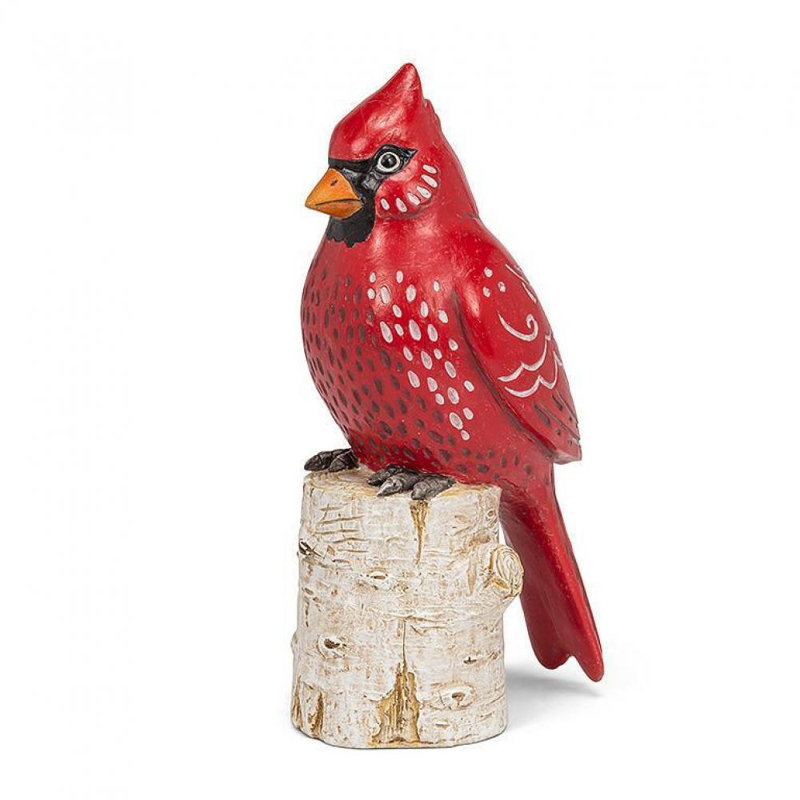 Figurine cardinal sur une souche de bouleau