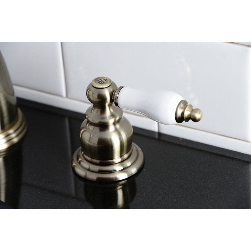 Kingston Brass Victorian Two-Handle 3-Hole Deck Mount Widespread Bathroom Faucet with Retail Pop-Up Drain, Vintage Brass