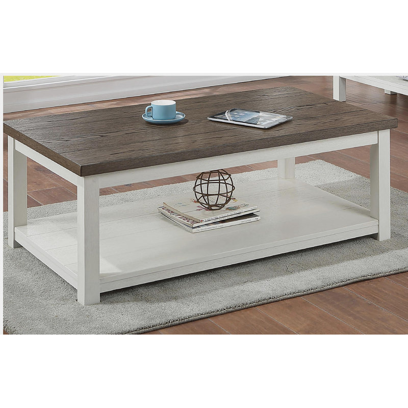 1 table basse brune de style campagnard avec base blanche et plateau de table rectangulaire avec roulettes
