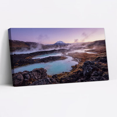 Impression sur toile Steamy Turquoise Hot Spring And Snowy Mountain