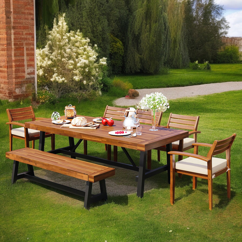 Jelyssa 8 - Person Acacia Solid Wood Patio Dining Set Rectangular Table with Cushions Included