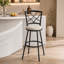 Ensemble de 2 tabourets pivotants élégants, aspect métal et cuir, pour un bar ou un îlot de cuisine contemporain.