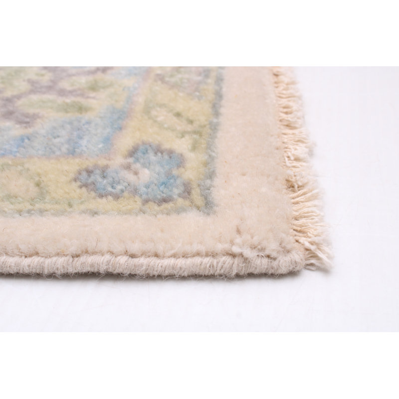 Tapis ivoire / bleu en laine noué à la main de style oriental rectangulaire Alerah 5 pi 5 po x 8 pi 5 po