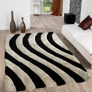 https://assets.wfcdn.com/im/09052597/resize-h300-w300%5Ecompr-r85/3975/39757382/Striped+Rug.jpg