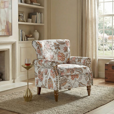Fauteuil avec garniture cloutée et pieds tournés
