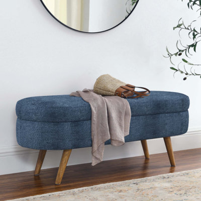 Banc de rangement repose-pieds ovale avec pieds en bois d'hévéa, tissu, assise polyvalente et solution de rangement pour n'importe quelle pièce