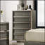 Commode à 5 tiroirs de style contemporain avec tiroirs supérieurs doublés de feutre et finition gris foncé, idéale pour les solutions de rangement modernes.