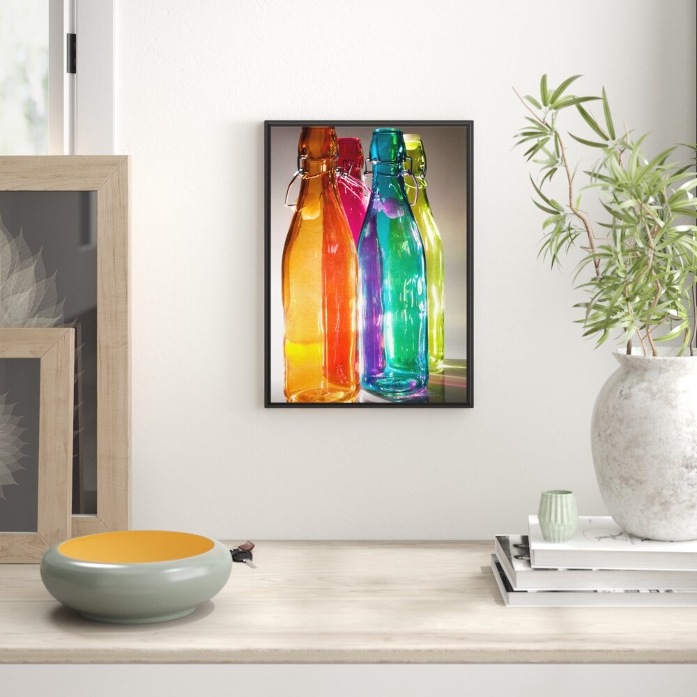 Gerahmtes Wandbild bunte Glasflaschen