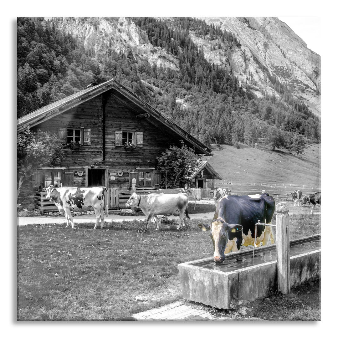 Glasbild Kühe vor Blockhütte auf Alpenweide