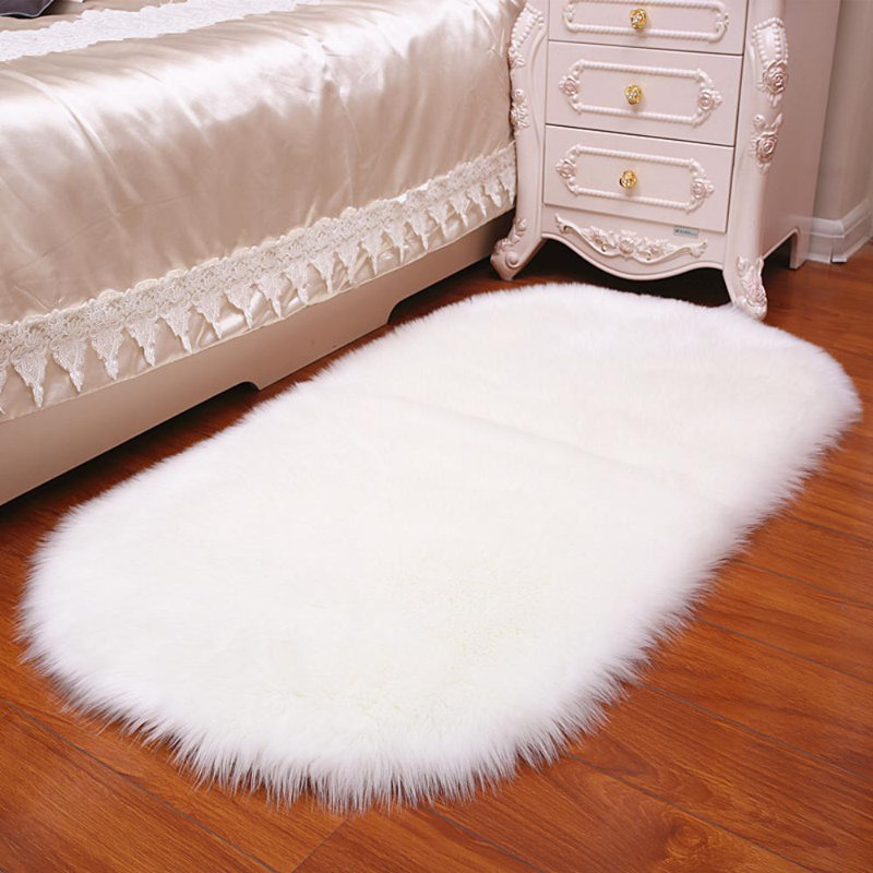 Oval Solid Colour Faux Sheepskin 120cm X 60cm Area Rug