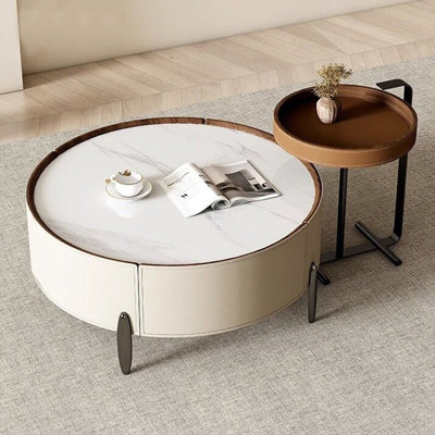 Table basse ronde avec plateau en pierre frittée et base en cuir