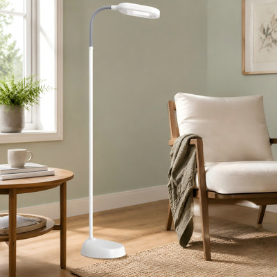 For reading, crafting, or sewing, this natural-daylight standing task lamp uses an adjustable gooseneck to position light in living rooms, bedrooms, and offices.