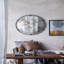 Miroir avec design rond et cadre industriel en métal