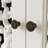 Elegant Two-Door Bathroom Cabinet With Cutout Panels & Dual Drawers