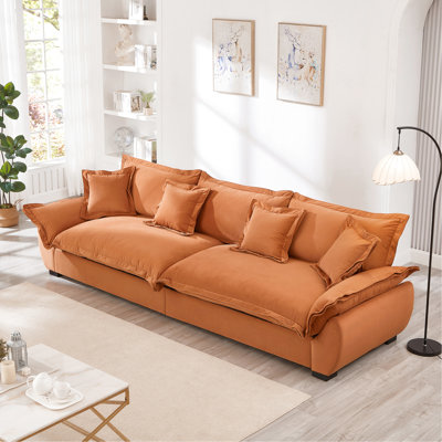 Canapé modulaire orange avec des housses lavables, une structure en bois massif et des coussins décoratifs pour appartement