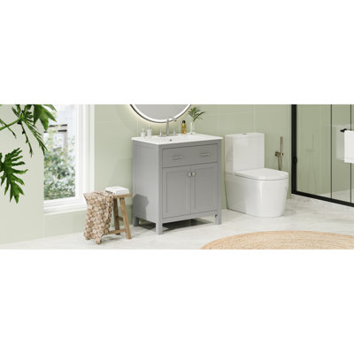 Meuble-lavabo moderne de 30 po. Armoire grise avec lavabo en céramique. 2 portes et tablette. Fermeture en douceur. Complète l'armoire de salle de bain. Portes, tiroir de tablette. Maximise l'utilité