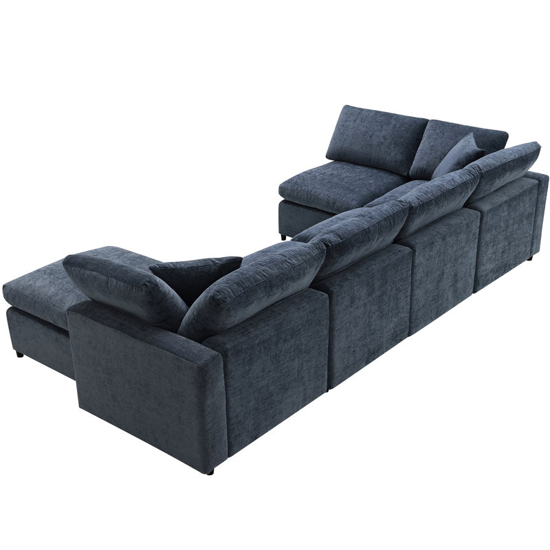 Espace de vie en forme de U avec canapé modulaire en chenille 6 places