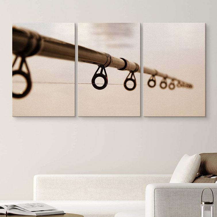 Close Up View Of Brown Fishing Rod Against The Water Surface On Canvas 3  Pieces Print
