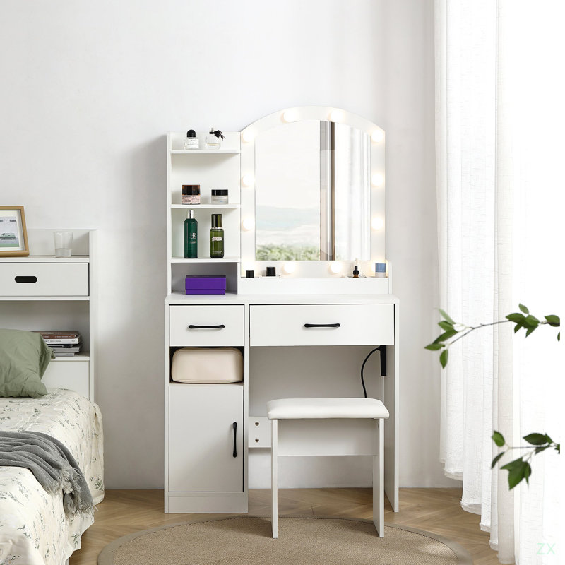 Ensemble de meuble-lavabo comprenant une table avec un grand miroir éclairé avec 2 tiroirs, une armoire de rangement et un tabouret rembourré