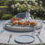 Anissah 6 - Person Patio Dining Set Umbrella Hole Included Round Table