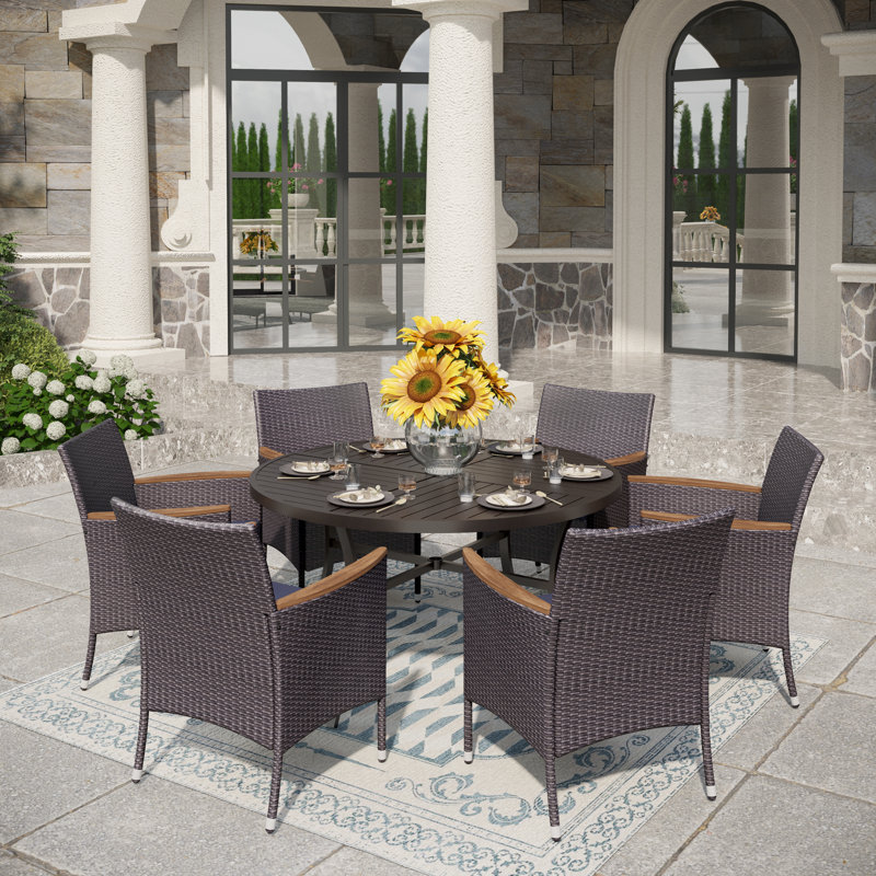 Sutiya 6 - Person Patio Dining Set with Round Table , Cushions Included