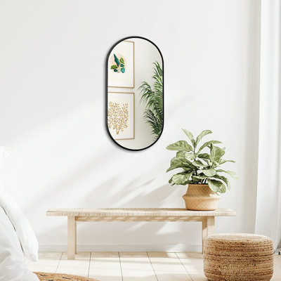 Miroir mural ovale en métal noir de 20 x 33 pouces avec verre de remplissage sans déformation de 4 mm de hauteur et processus d'installation facile. 20 x 33 pouces faits de crochets renforcés pour plus de sécurité
