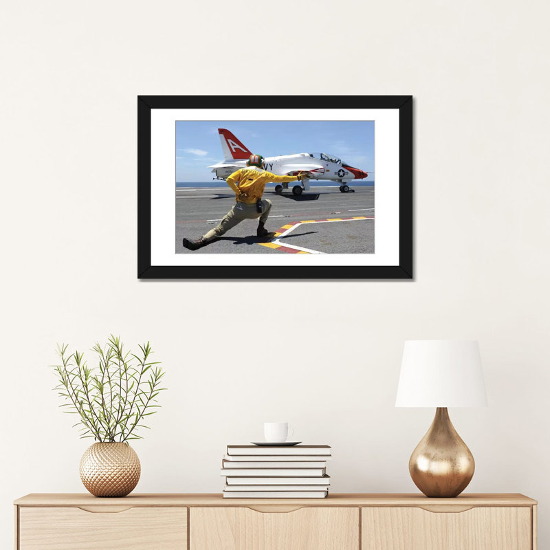 Shooter Signals To A T-45C Goshawk As It Launches From USS George HW Bush by Stocktrek Images - Wrapped Canvas Photograph